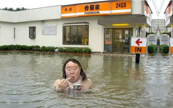 fat-asian-chick-eating-something-in-a-flood